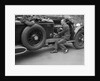 Geoffrey Baker inspecting the engine of a Minerva car by Bill Brunell