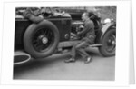 Geoffrey Baker inspecting the engine of a Minerva car by Bill Brunell