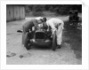 Mechanics working on Leon Cushman's Austin 7 racer for a speed record attempt, Brooklands, 1931 by Bill Brunell