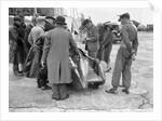 People examining Leon Cushman's Austin 7 racer at Brooklands for a speed record attempt, 1931 by Bill Brunell