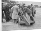 People examining Leon Cushman's Austin 7 racer at Brooklands for a speed record attempt, 1931 by Bill Brunell