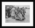 People examining Leon Cushman's Austin 7 racer at Brooklands for a speed record attempt, 1931 by Bill Brunell