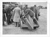 People examining Leon Cushman's Austin 7 racer at Brooklands for a speed record attempt, 1931 by Bill Brunell