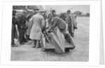 People examining Leon Cushman's Austin 7 racer at Brooklands for a speed record attempt, 1931 by Bill Brunell