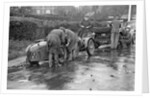 Attaching snow chains to JE Lancaster's Riley Brooklands during the Inter-Varsity Trial, 1930 by Bill Brunell