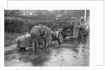 Attaching snow chains to JE Lancaster's Riley Brooklands during the Inter-Varsity Trial, 1930 by Bill Brunell