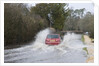 Rover Metro driving through floods at Beaulieu 2008 by Unknown