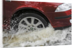 Car driving through flood by Unknown