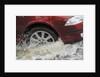 Car driving through flood by Unknown