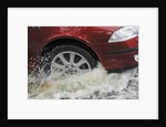 Car driving through flood by Unknown