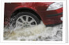 Car driving through flood by Unknown