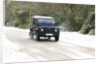 2002 Land Rover Defender driving on snowy road, 2009 by Unknown