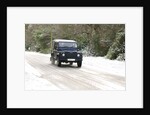 2002 Land Rover Defender driving on snowy road, 2009 by Unknown