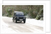 2002 Land Rover Defender driving on snowy road, 2009 by Unknown