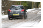 2009 Mazda 2 driving on snowy road by Unknown