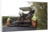 Road resurfacing work repairing potholes by Unknown