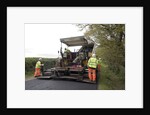Road resurfacing work repairing potholes by Unknown