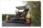 Road resurfacing work repairing potholes by Unknown