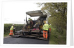 Road resurfacing work repairing potholes by Unknown