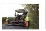 Road resurfacing work repairing potholes by Unknown