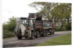 Road resurfacing work repairing potholes by Unknown
