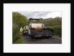 Road resurfacing work repairing potholes by Unknown