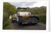 Road resurfacing work repairing potholes by Unknown