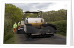 Road resurfacing work repairing potholes by Unknown