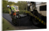 Road resurfacing work repairing potholes by Unknown