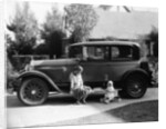 Stan Laurel at the wheel of 1927 Hupmobile with his wife Lois and daughter Lois by Unknown