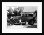 Stan Laurel at the wheel of 1927 Hupmobile with his wife Lois and daughter Lois by Unknown