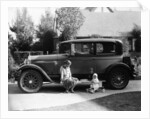 Stan Laurel at the wheel of 1927 Hupmobile with his wife Lois and daughter Lois by Unknown