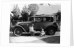 Stan Laurel at the wheel of 1927 Hupmobile with his wife Lois and daughter Lois by Unknown