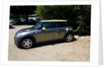 Electric Mini at battery charging point 2011 by Unknown
