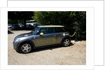 Electric Mini at battery charging point 2011 by Unknown