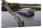 Ford Focus in flooded ditch after losing control on wet road 2012 by Unknown