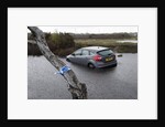 Ford Focus in flooded ditch after losing control on wet road 2012 by Unknown