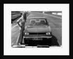 1969 Hillman Hunter GT with female model by Unknown