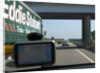 Passing Eddie Stobart truck on the A46 with satnav screen on windscreen by Anonymous