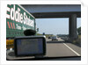 Passing Eddie Stobart truck on the A46 with satnav screen on windscreen by Anonymous