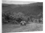 Singer 2-seater competing in the Mid Surrey AC Barnstaple Trial, Beggars Roost, Devon, 1934 by Bill Brunell