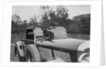 Dachshund sitting on the bonnet of Charles Mortimer's Bentley, c1930s by Bill Brunell