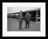 Two men chatting at Brooklands motor racing circuit, Surrey, 1920s by Bill Brunell
