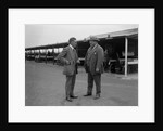 Two men chatting at Brooklands motor racing circuit, Surrey, 1920s by Bill Brunell