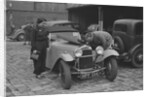 AES Curtis looking under the bonnet of his HRG at the RAC Rally, 1939 by Bill Brunell