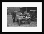 AES Curtis looking under the bonnet of his HRG at the RAC Rally, 1939 by Bill Brunell