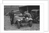 AES Curtis looking under the bonnet of his HRG at the RAC Rally, 1939 by Bill Brunell