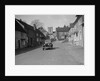 Standard Sixteen saloon driving down the High Street, Hambledon, Hampshire, 1930s by Bill Brunell