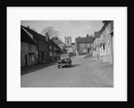 Standard Sixteen saloon driving down the High Street, Hambledon, Hampshire, 1930s by Bill Brunell