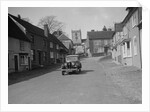 Standard Sixteen saloon driving down the High Street, Hambledon, Hampshire, 1930s by Bill Brunell